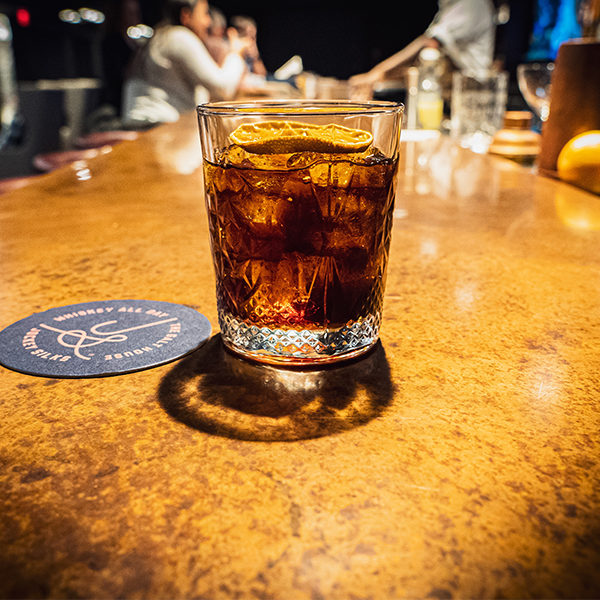 a signature cocktail at jockey silks bourbon bar