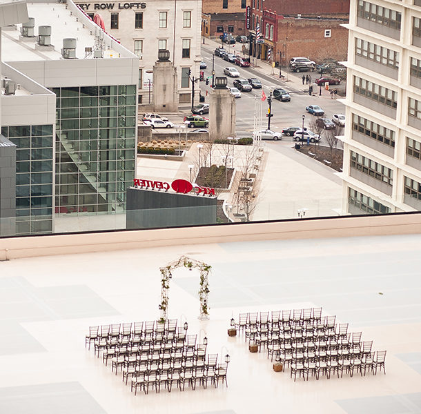 The setting of a rooftop wedding located on top of the Galt House's East Tower with a view looking east over the KFC Yum! Center